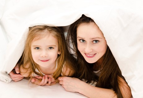 Mother and daughter under blanket - Special Needs Essentials